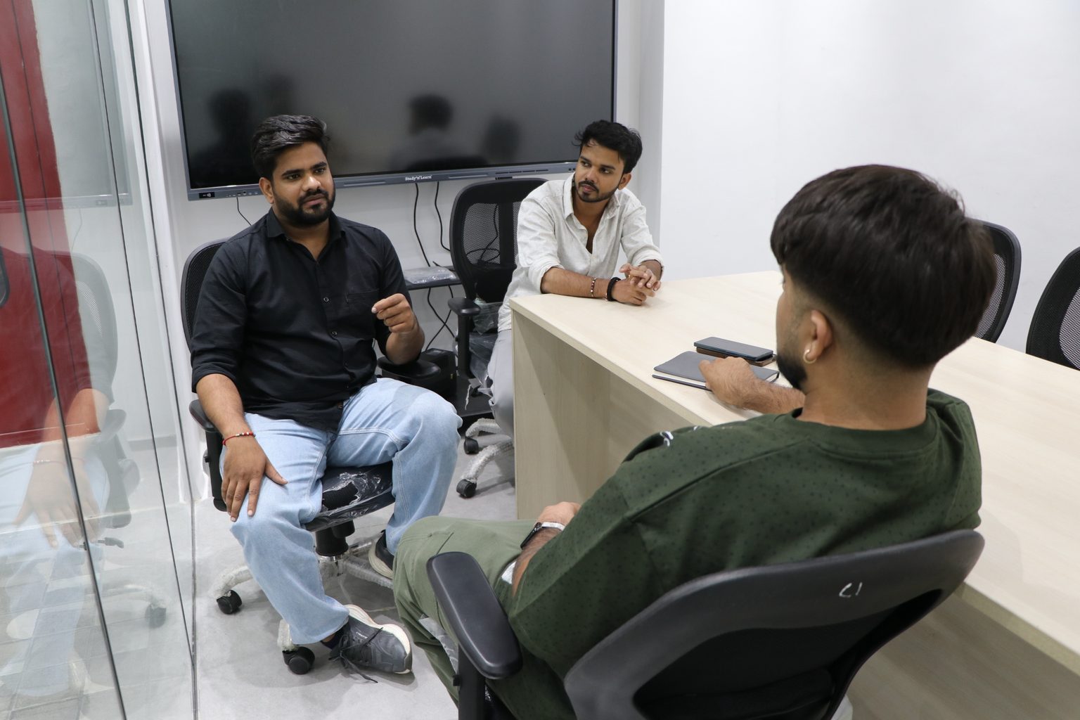 EGN India team members discussing at the Noida office